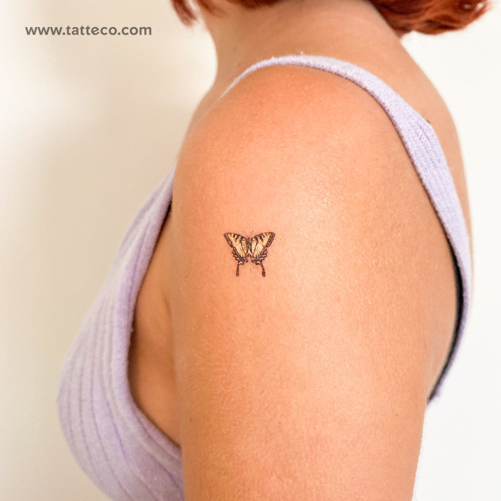 yellow butterfly tattoo