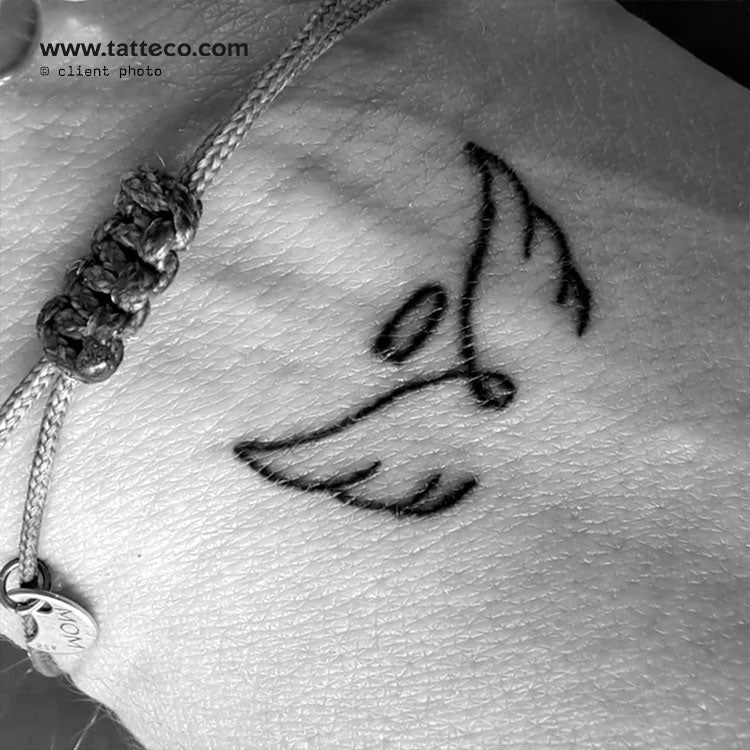 faith tattoo with angel wings
